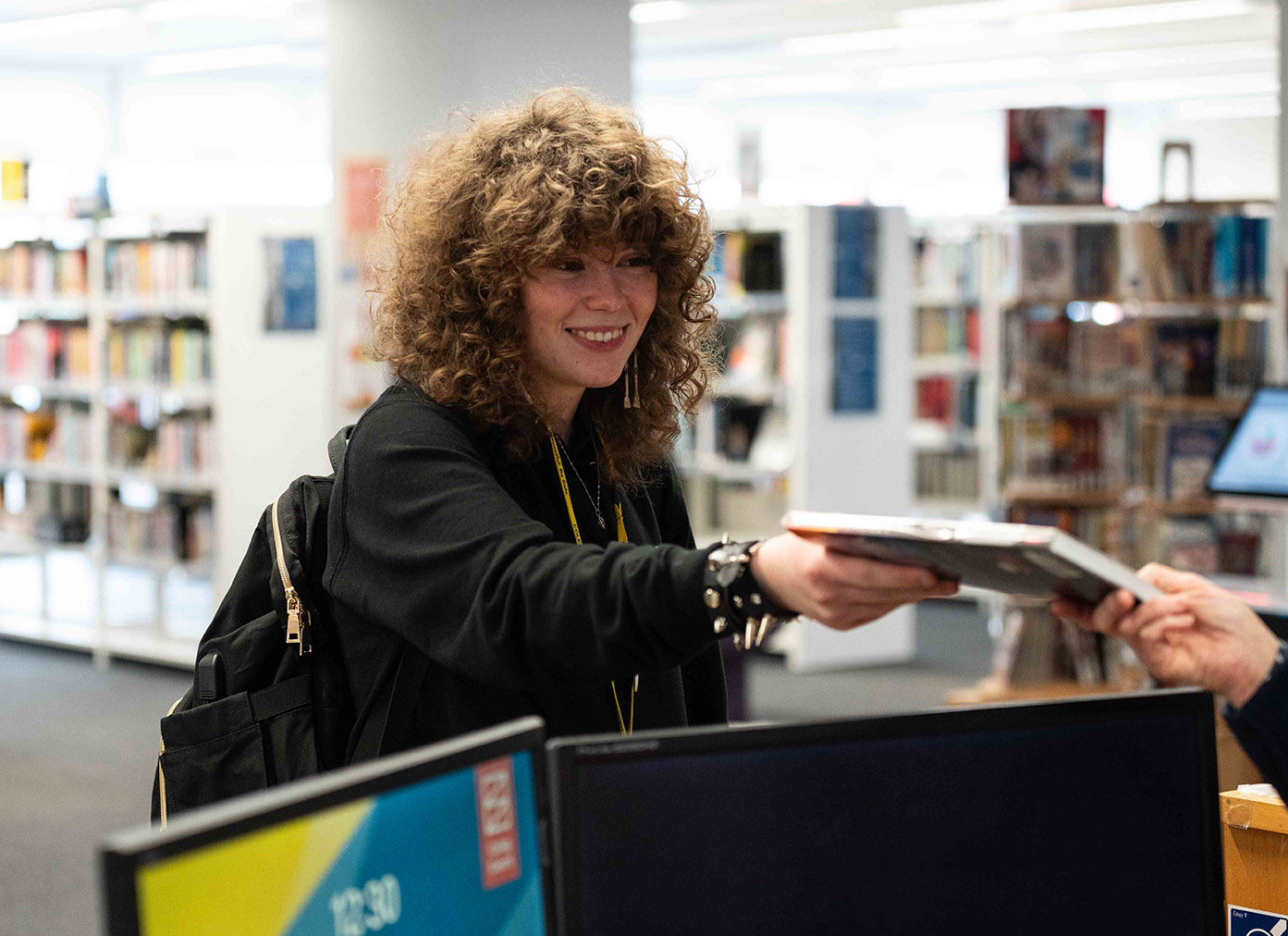 Student-Smiling-in-Library