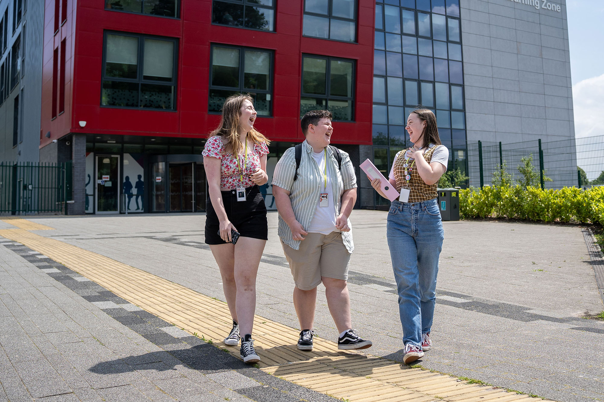 Students smiling outside TLZ