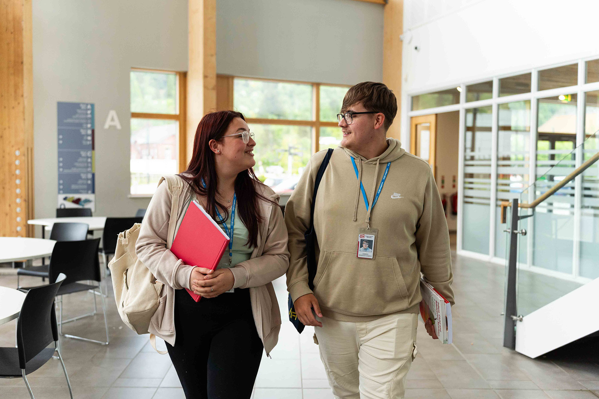 Higher education students walking through campus